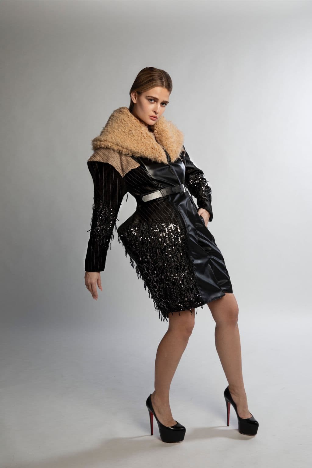 Model wearing a black and white construction look with dramatic styling